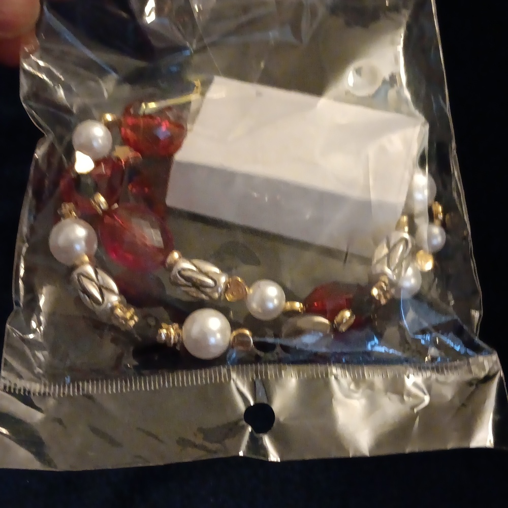 A red and white bracelet with stars
